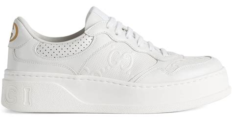 Women's GG trainer in white leather .